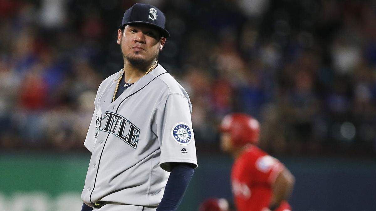 Adrian Beltre circles the bases Tuesday night behind Felix Hernandez after taking his buddy deep for a home run. Beltre didn’t say a work of smack talk in an 11-4 game.