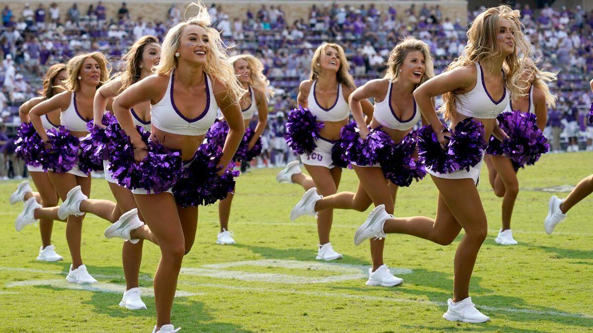 The TCU Showgirls perform during a Horned Frogs football game.