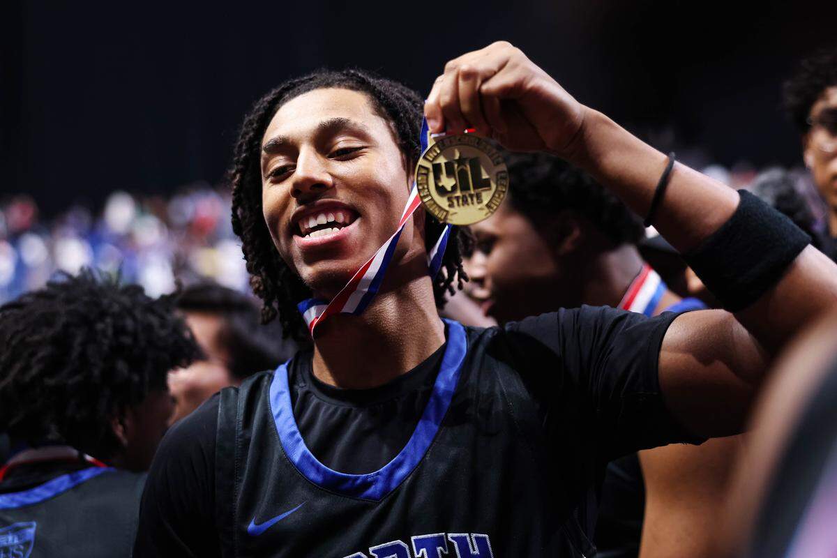 North Crowley wing Jonathan Fox holds the gold medal after winning the Class 6A Division I state championship game against San Antonio Brennan on Saturday at the Alamodome in San Antonio.