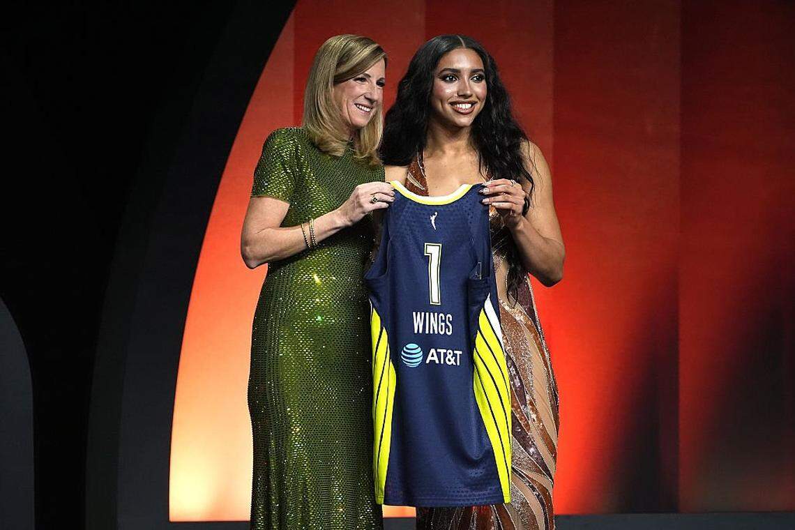 UConn guard Azzi Fudd poses with WNBA commissioner Cathy Engelbert after being selected by the Dallas Wings with the first overall pick in the WNBA draft Monday in New York.