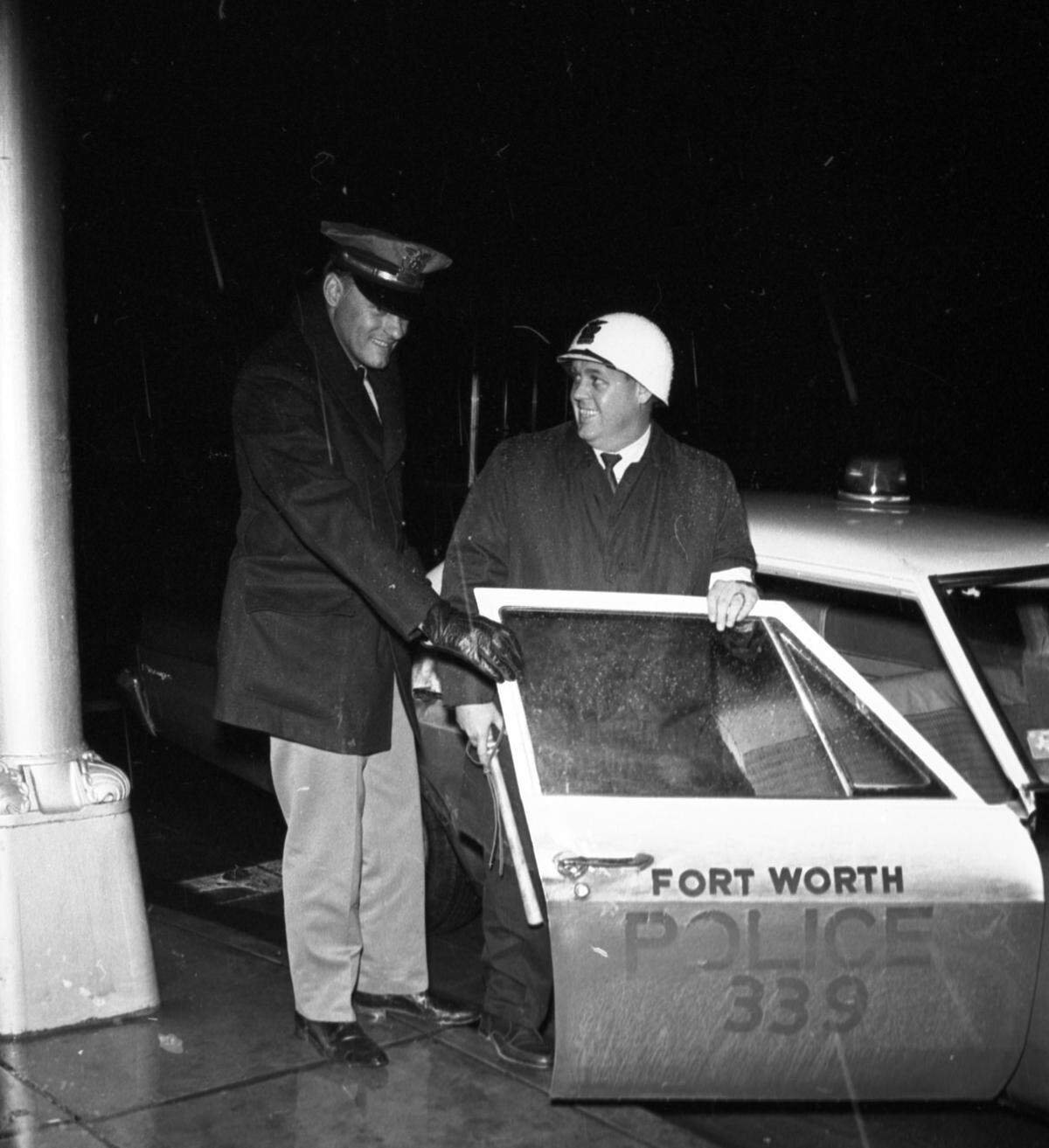 Fort Worth police Officer D.D. Sanders, left, with citizen volunteer R.D. Sherrill on Dec. 16, 1967. The police department was the first in the nation to experiment with “citizen policemen.” Sherrill, a publications editor for Ken Davis Industries, helped Sanders make two arrests and helped break up a fight, during which he “had to use a choke hold.”