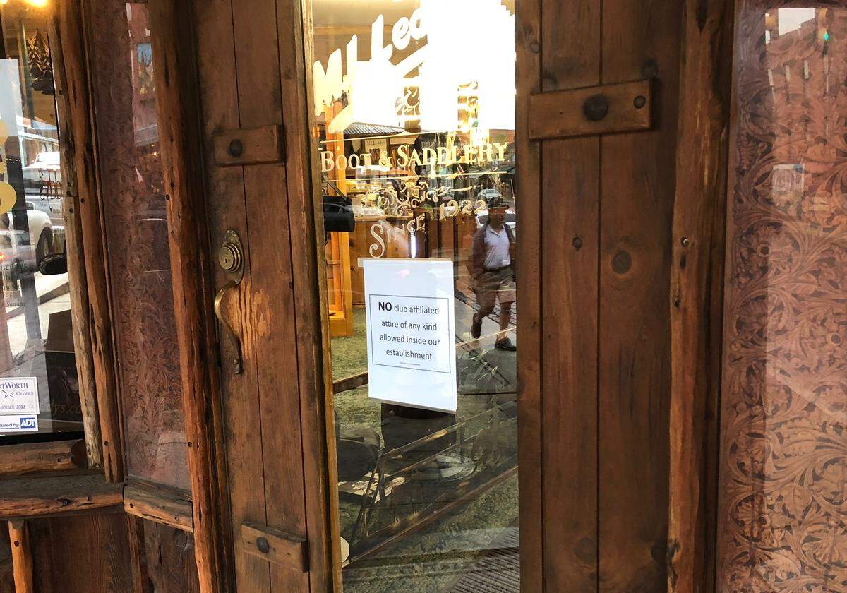 Some establishments at the Stockyards had signs on their doors stating, “NO club affiliated attire of any kind allowed inside our establishment.”