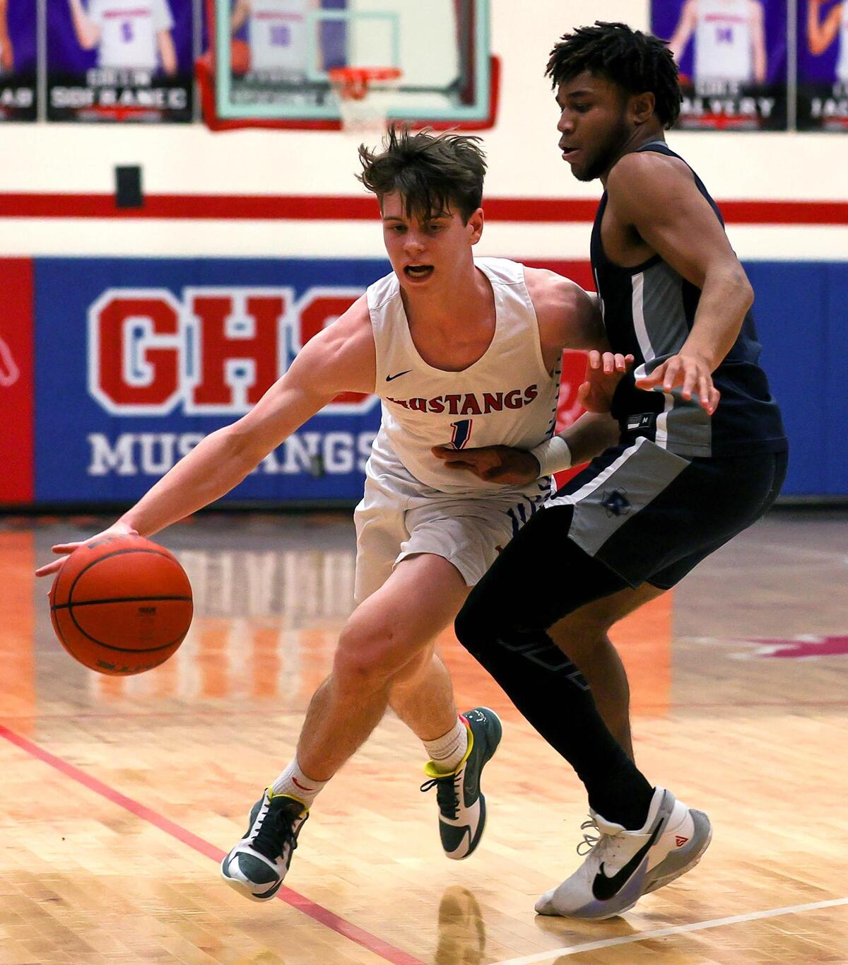Grapevine guard Jackson Waggoner (1) tries to dribble around Richland guard CJ Nelson (r) during the first half of a High School basketball game, January 25, 2021, played at Grapevine High School in Grapevine, Tx. (Steve Nurenberg Special to the Star-Telegram)