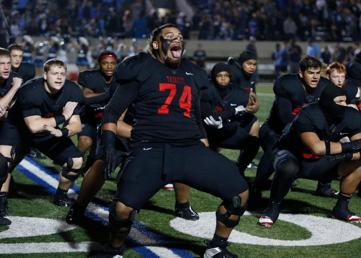Trinity’s Phillip Tuipulotu leads the team in a Haka pregame dance during a UIL football game at Pennington Field on Friday November 7, 2024.