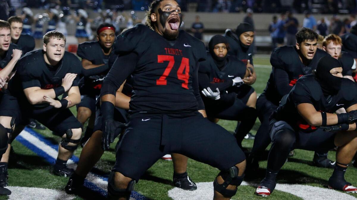 Trinity’s Phillip Tuipulotu leads the team in a Haka pregame dance during a UIL football game at Pennington Field on Thursday, November 7, 2024.