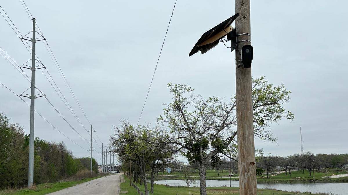 A license plate reading camera manufactured and operated by Flock Safety installed on a utility pole near Echo Lake in south-central Fort Worth.