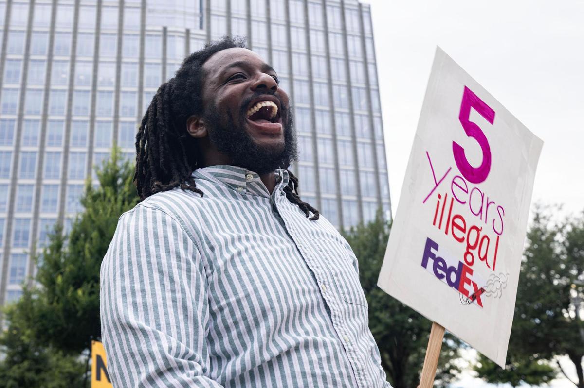 Caleb Roberts, the Executive Director of Downwinders at Risk, protests in support of the Echo Heights neighborhood outside of the City Hall building in downtown Fort Worth on Tuesday, June 10, 2025. FedEx applied for a permit to allow parking of semi-trucks and trailers in a part of the Echo Heights neighborhood, prompting a protest by the Fort Worth Environmental Coalition of Communities—a group of residents fighting environmental racism—urging the city to deny the permit.