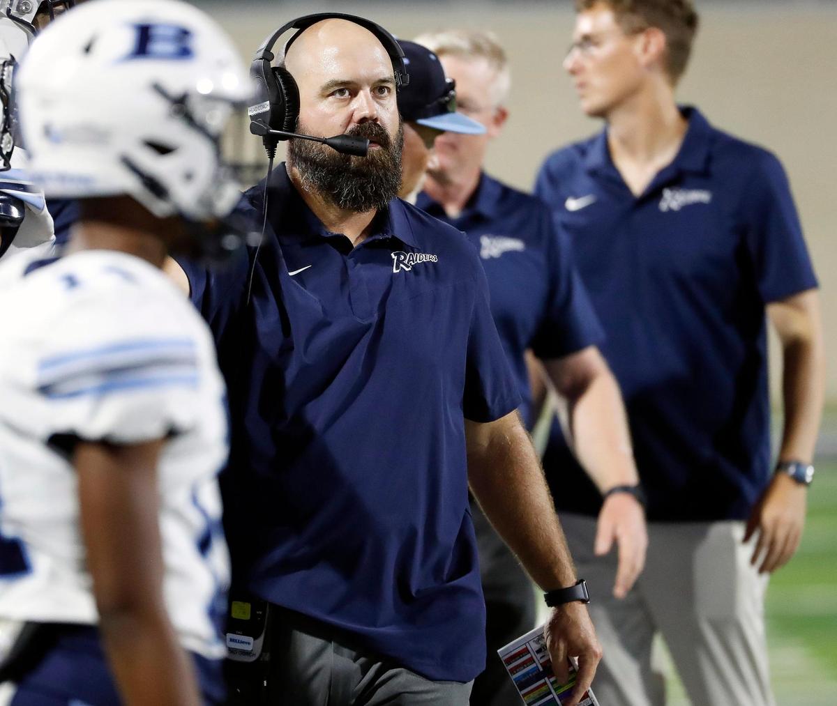 L.D. Bell head coach TJ Dibble glances to the score board in the second half of a high school football game at Crowley ISD Multipurpose Stadium in Crowley Texas, Friday, Sept. 23, 2022. L.D. Bell defeated Crowley 21-17. (Special to the Star-Telegram Bob Booth)