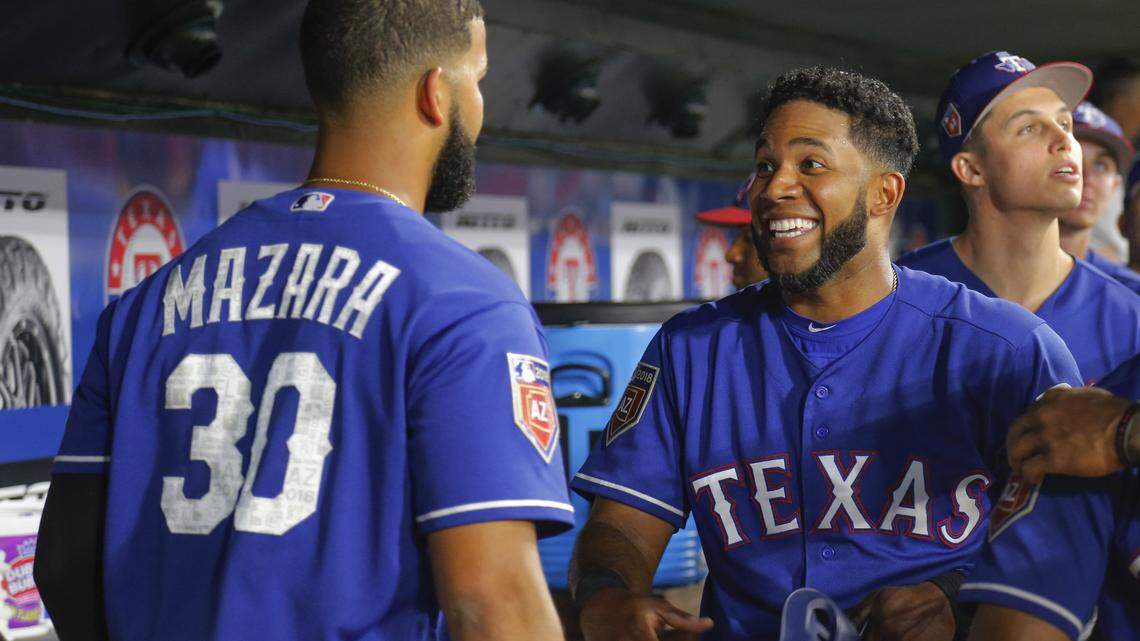 Texas Rangers shortstop Elvis Andrus (1) smiles as he scores in the third inning on a double by designated hitter Shin-Soo Choo (17)  as the Cincinnati Reds play the Texas Rangers in an exhibition game at Globe Life Park in Arlington, Texas, Monday, March 26, 2018.