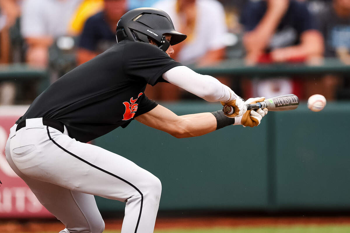 An Aledo hitter lays down a bunt against Montgomery Lake Creek in the UIL Class 5A Division I baseball state championship game on Friday, June 5, 2026, at Dell Diamond in Round Rock, Texas.