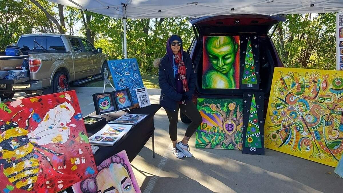 Local artists at a previous Keller Art Festival showcasing canvas art.
