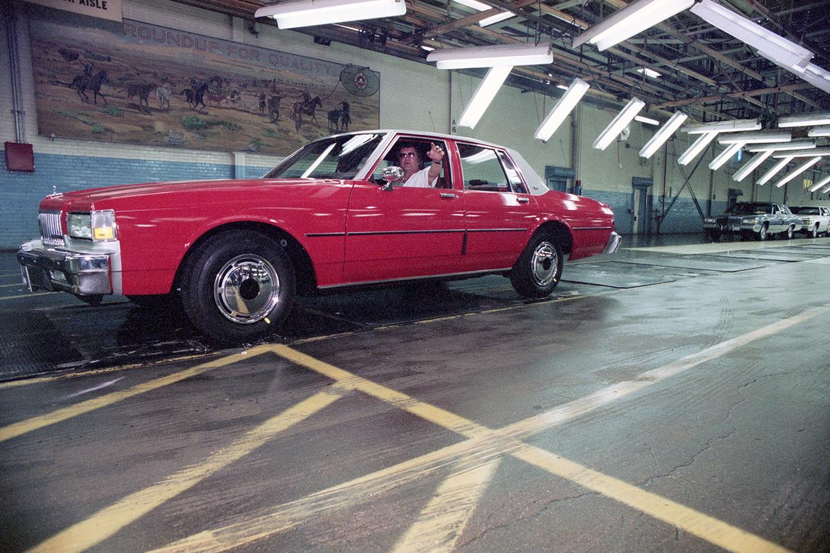 April 19, 1990: Nick Champion prepares to drive the last Chevrolet Caprice off the assembly line at the Arlington General Motors plant before the factory shuts down to retool for a new Caprice.