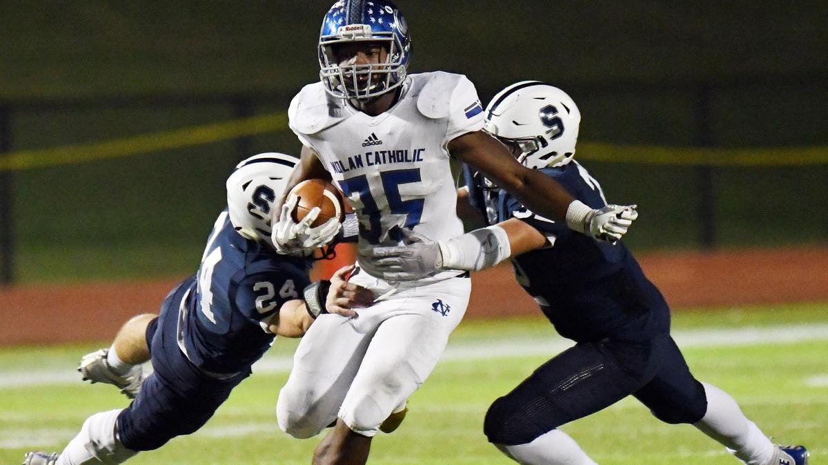 Nolan Catholic’s Emeka Megwa,center, escapes All Saints’s Peyton Kramer, left and Charles Sanders to get out of the backfield during the second quarter of Friday’s November 2, 2018 football game at McNair Stadium in Fort Worth, Texas. Special/Bob Haynes