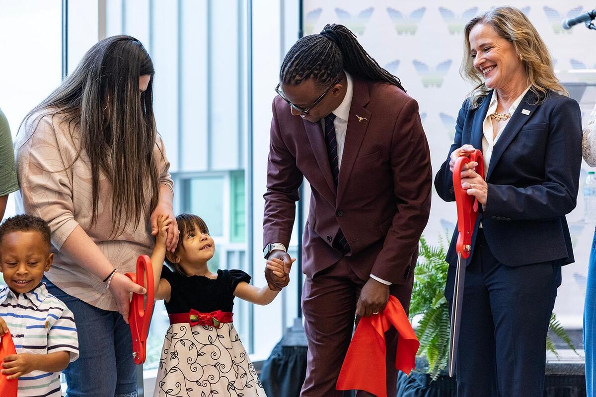 Ariel Vasquez, a client with the Center for Transforming Lives, and her daughter Maddison Ledesma, 4, meets city councilmember Chris Nettles, second from right, and Carol Klocek, the CEO of Center for Transforming Lives, during the grand opening ceremony of the brand new Riverside Campus in the Morningside neighborhood of Fort Worth on Friday, May 2, 2025.