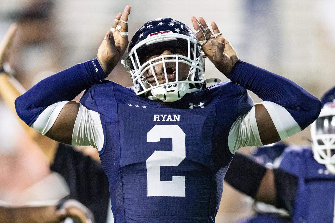 Denton Ryan defensive lineman Kha'ron Freeman-Wade (2) celebrates after getting a sack in the first half of a high school football game between the Aledo Bearcats and the Denton Ryan Raiders at C.H. Collins Athletic Complex in Denton on Friday, Oct. 3, 2025. 