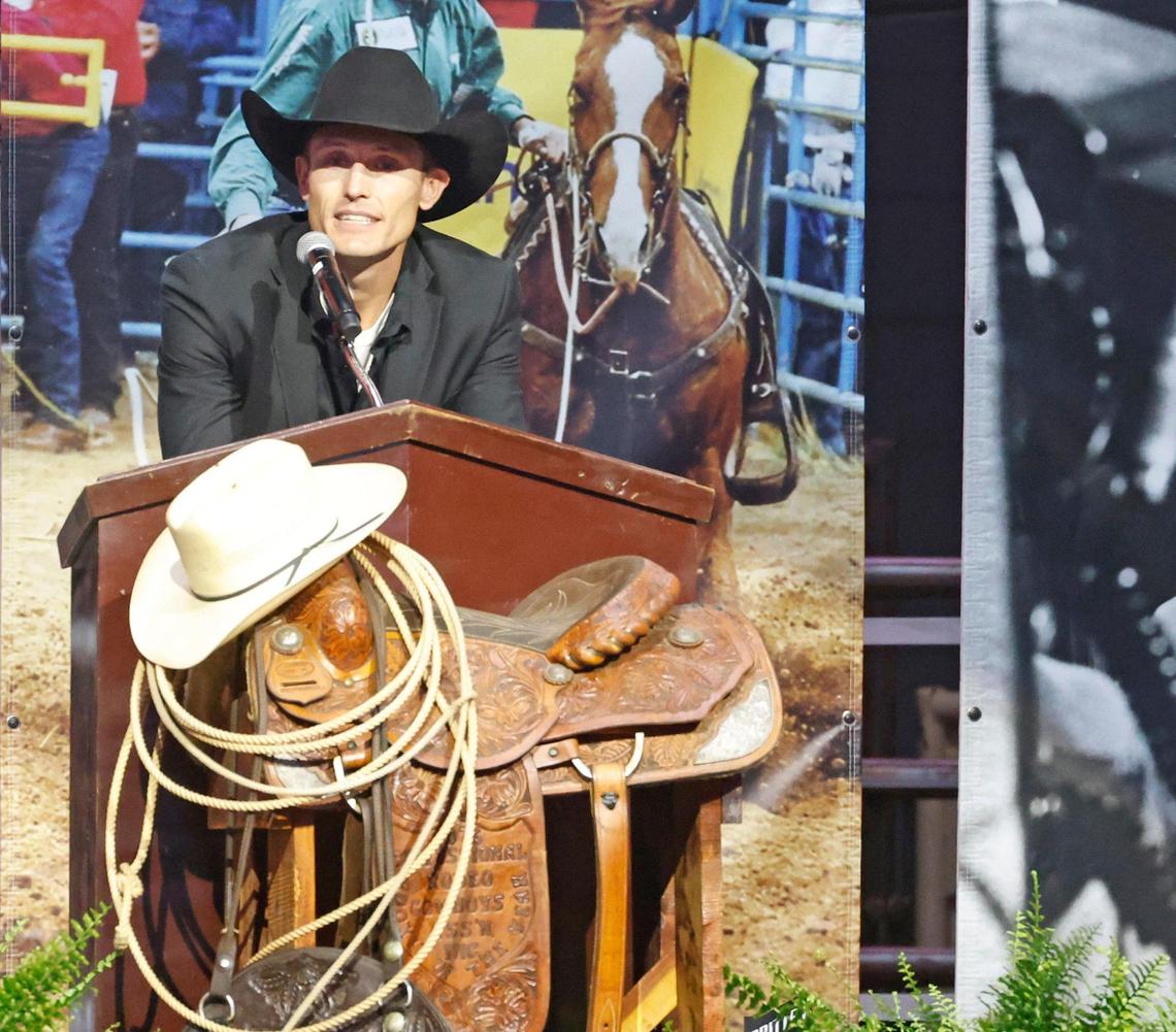 Tuf Cooper talks about his dad during a memorial service for world champion calf roper Roy Dale Cooper at Cowtown Coliseum in Fort Worth on Monday.