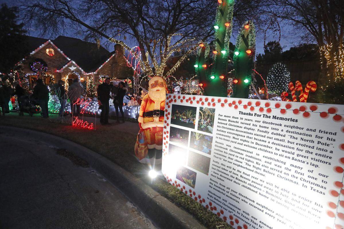 A sign outside the home of Dennis Bianchi explains the lighting tradition and notes this is the final year in the Glenbrook neighborhood in Bedford, Texas, Sunday, Nov. 25, 2018.