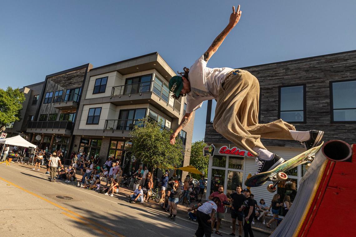 Josh Bruda performs a skate trick on a ramp in the skate jam area of Open Streets on Magnolia Avenue in Fort Worth on Saturday.