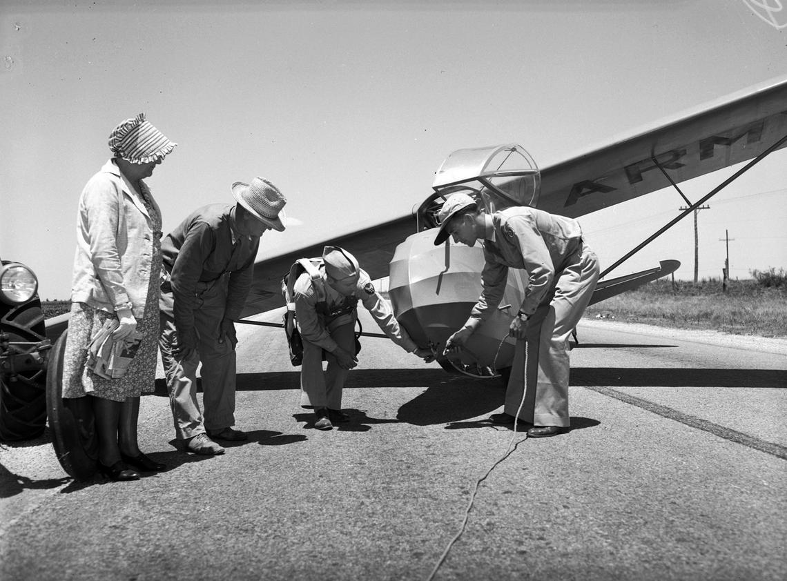 The military trained with gliders like this early in World War II. Here, at Lamesa Advanced Air Force Glider School in West Texas, farmers George W. Holley and his wife rode up on a tractor to get a look at a giant motorless glider. Air Force Sgt. Don D. Fritz, middle, was a new graduate of the school and had just landed the glider on a rural road. Sheriff Buck Bennett kept the highway clear for the practice stunt that is part of training.