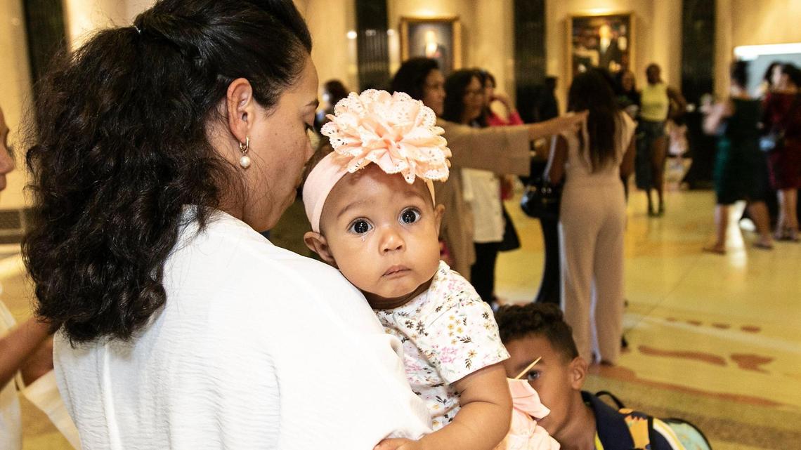 Genesis Moore holds her 6-month-old daughter Giselle Moore. Moore graduated from the United Way of Tarrant County’s community doula program at a ceremony at Southwestern Baptist Theological Seminary on Oct. 26, 2024.