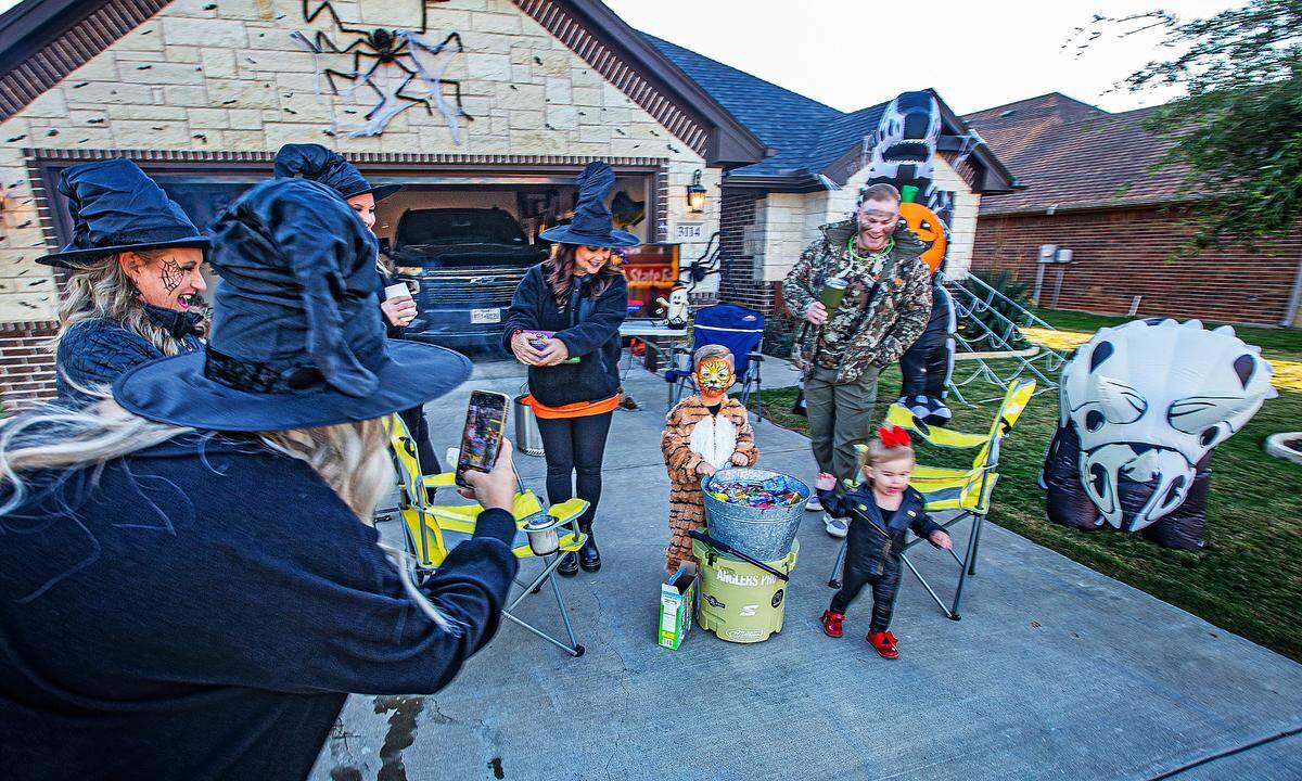 The Middlebrooks in Acton were ready for the gaggle of costumed children and adults who walked down Main Street at their residential subdivision Tuesday, Oct. 31, 2023.