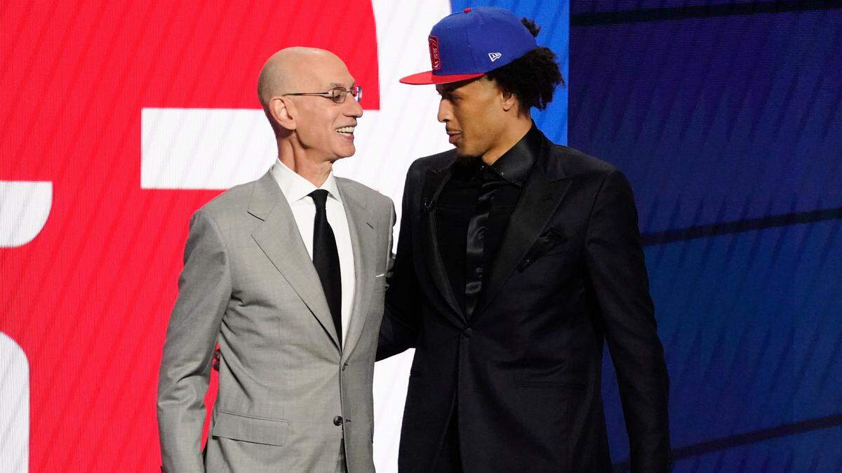 Oklahoma State guard Cade Cunningham, right, greets NBA Commissioner Adam Silver after being selected No. 1 by the Detroit Pistons in Thursday’s draft. Cunningham spent two years in high school at Arlington Bowie.