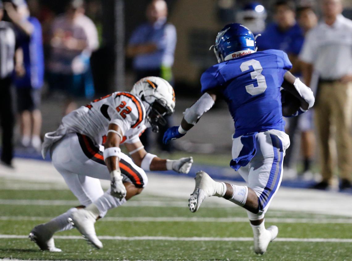 Weatherford’s Dezmond Forrest (3) outruns Haltom’s Johnny Smith-Rider (22) for a touchdown in the second quarter. The Haltom Buffalos played the Weatherford Kangaroos at Kangaroo Stadium in Weatherford Thursday, Oct. 3, 2019.
