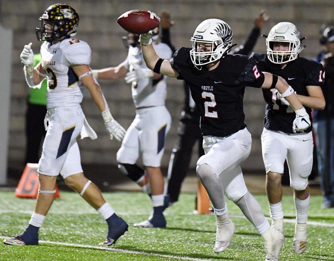 Argyle’s Jake Sullivan, center, celebrates as he runs off the field after interceping a Stephenville pass stopping the Yellowjacket’s last drive of the game in the fourth quarter of an area playoff football game at Vernon Newsom Stadium in Mansfield, Texas on Thursday, November 21, 2019. Argyle won 63-49. Special/Bob Haynes