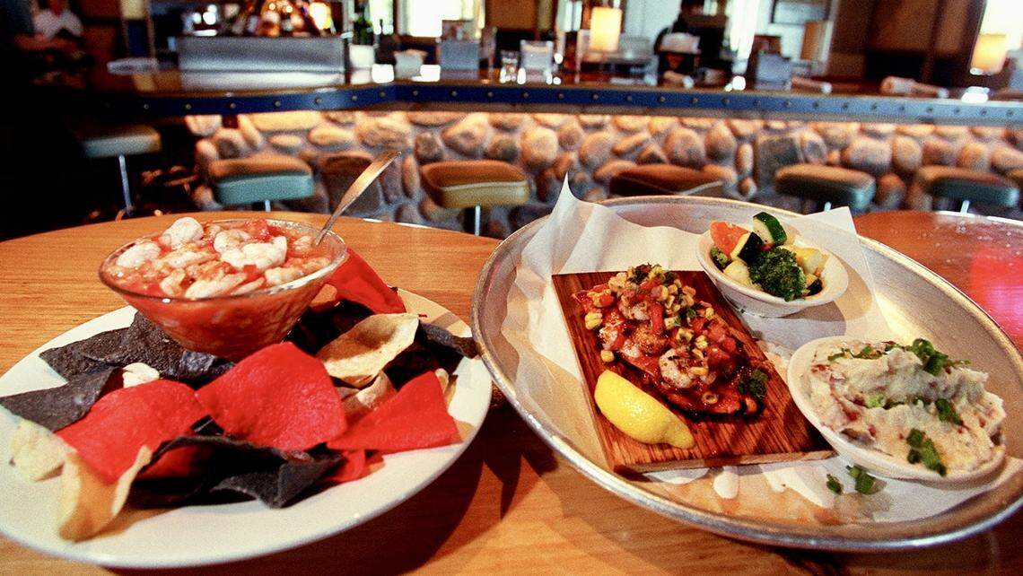 A “shrimo martini” and cedar-plank salmon at Rockfish Seafood’s Arlington location.