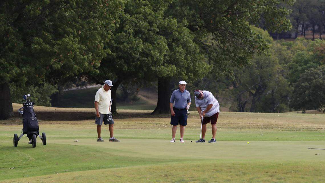 A threesome on a green at Meadowbrook Golf Course on Sept. 26, 2017.