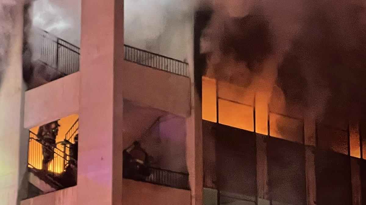 Arlington firefighters at 848 Mitchell, apartments marketed toward UT Arlington students, combat a blaze in the garage that appeared to spread to multiple cars and caused multiple small explosions.