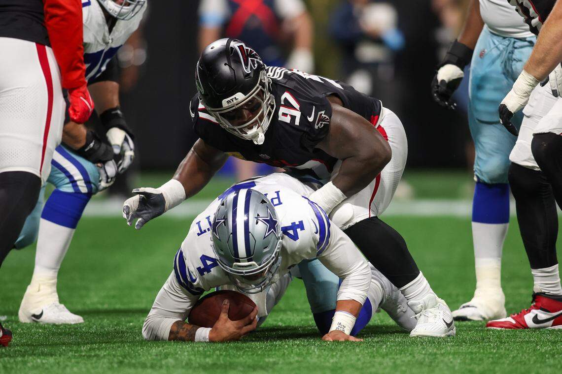 Atlanta Falcons defensive end Grady Jarrett (97) sacks Dallas Cowboys quarterback Dak Prescott (4) on Oct. 27. Prescott suffered a season-ending injury during hte game.