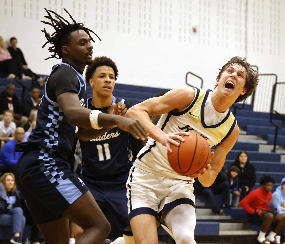 Keller point Cash Erdmann (1) works into the key defended by L.D. Bell forward Imani Reynolds (21) during the first half of a UIL boys basketball game between L.D. Bell and Keller at Keller High School in Keller, Texas, Friday Jan. 16, 2026