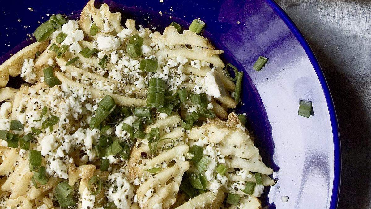 The Gorgonzola waffle fries are a signature dish at Lili’s Bistro in Fort Worth.