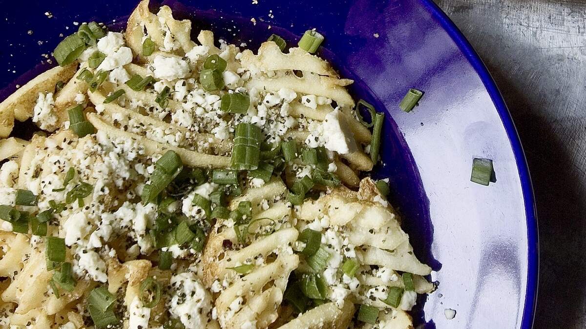 The Gorgonzola waffle fries are a signature dish at Lili’s Bistro in Fort Worth.
