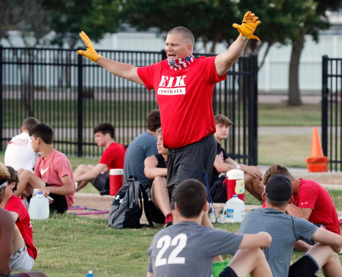 Elks head coach Jon Kitna talks about distancing before workouts at Burleson High School in Burleson, Monday, June 08, 2020. Most of the workouts coaches yelled either “space, space, space,” or “ six feet, six feet, six feet>” Football, boys and girls basketball and volleyball worked out for the first time Monday. Most of the days workouts were instructional on procedures and how to social distance to stay healthy. (Special to the Star-Telegram Bob Booth)