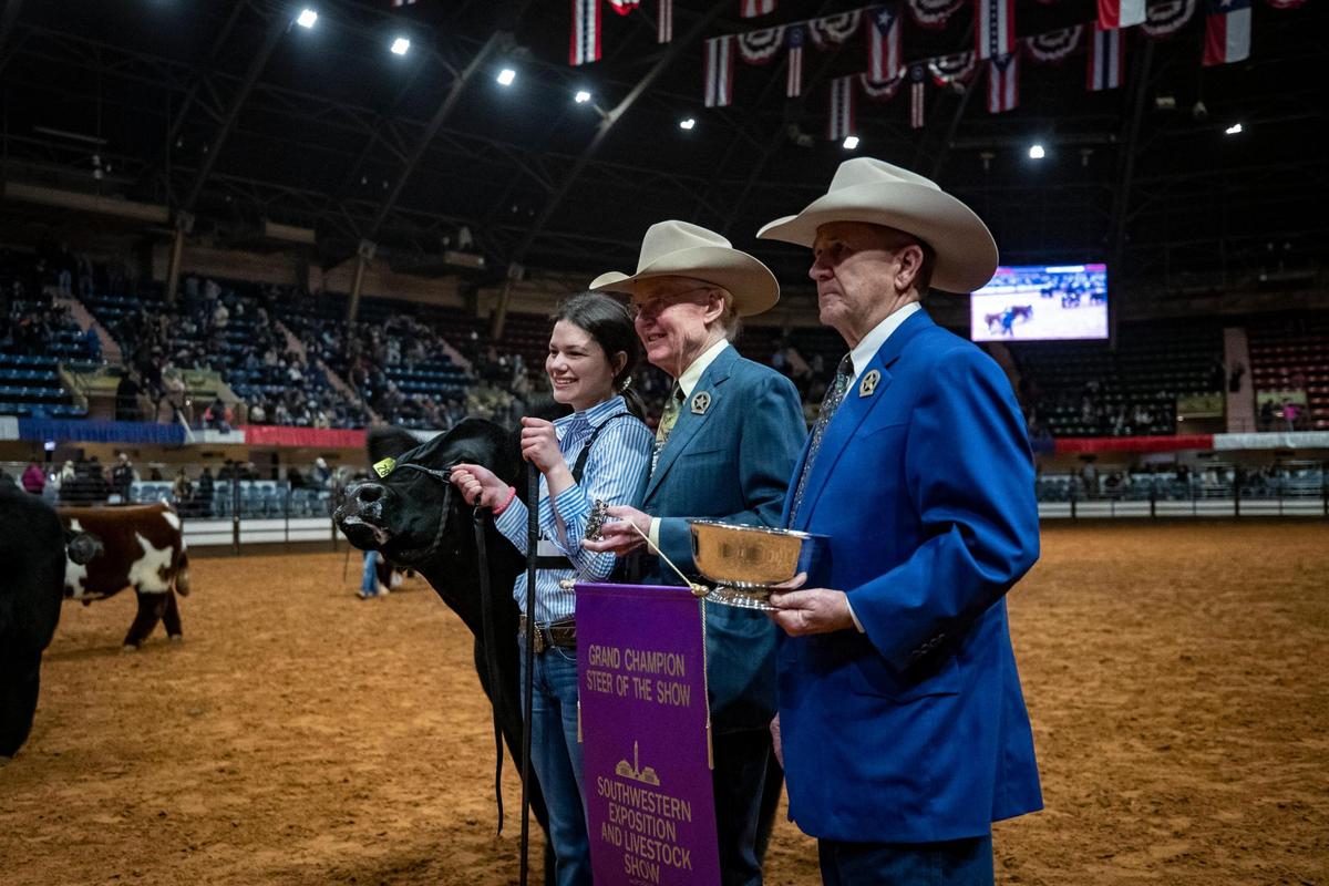 Sadie Wampler, 15, poses with judges after her steer was recognized as Grand Champion during the Fort Worth Stock Show and Rodeo’s Jr. Steer Show on Friday, Feb. 3, 2023.