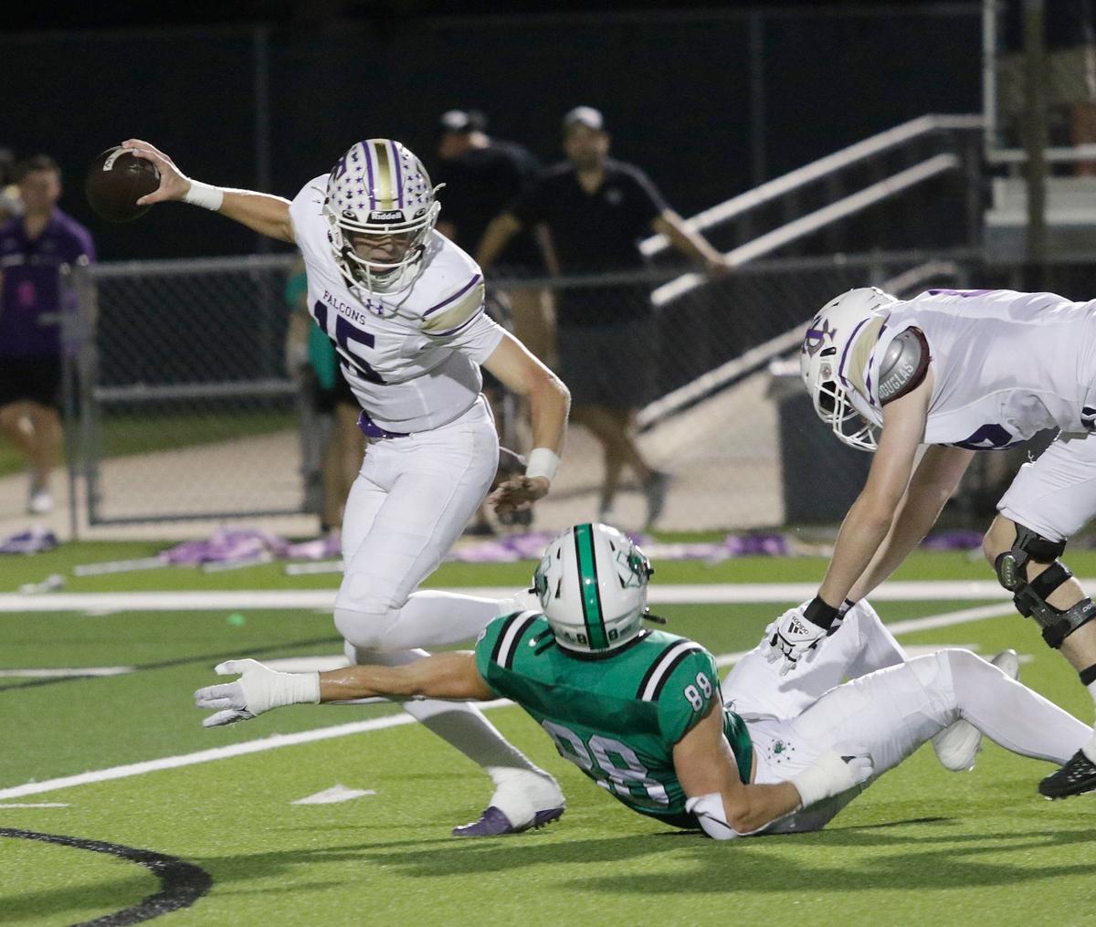 Timber Creek’s Carson Porter can’t escape a tackle from Southlake Carroll’s Jack Van Dorselaer during a UIL football game at Dragon Stadium on Friday, Sept. 27, 2024.