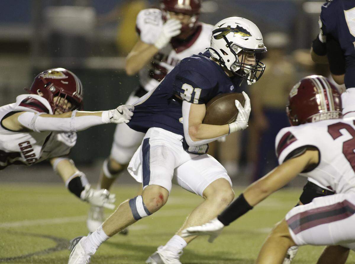 Keller’s Blake Dyniewski (31) breaks a tackle against Keller Central during their game at Keller ISD Athletic Complex on Friday, Sep. 26, 2025.