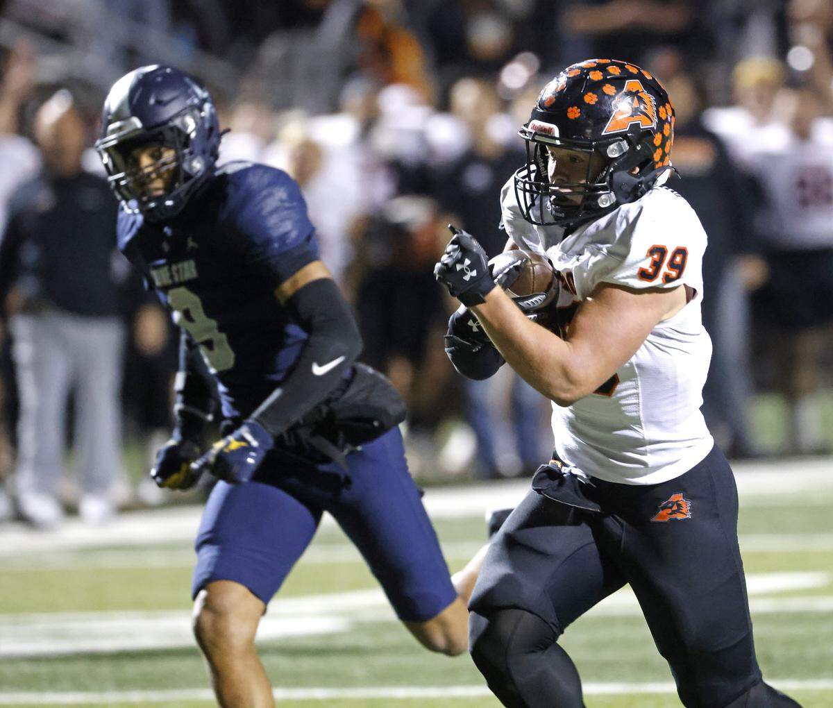 Aledo running back Brady Powell (39) beats Frisco Lone Star outside linebacker Jordan Deck (9) to the end zone for six during the first half of a UIL Class 5A Division I Semifinal on Friday Dec. 12, 2025 at Vernon Newsom Stadium in Mansfield, Texas.