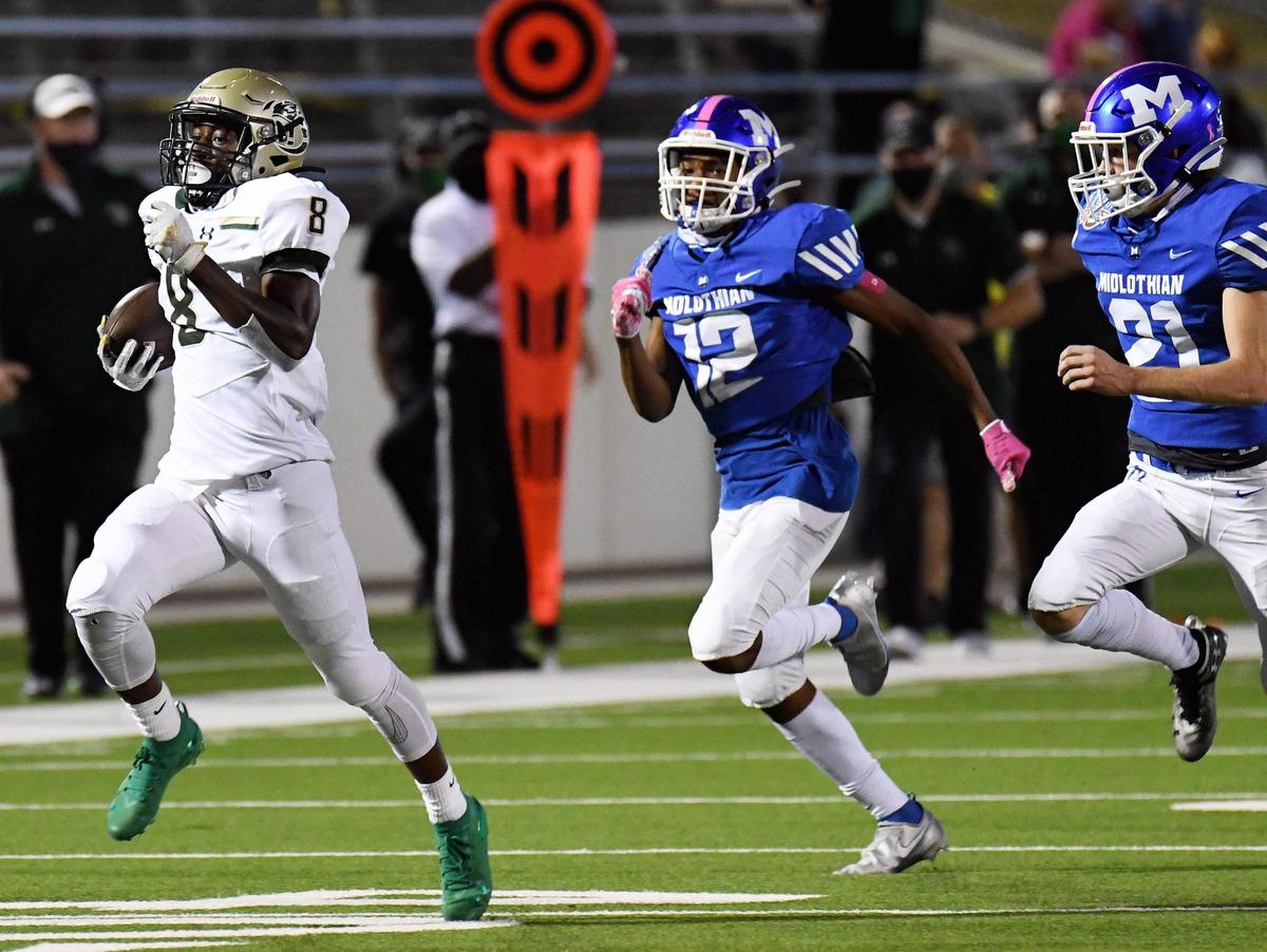 Birdville’s Gracien Anto races 76 yards as Midlothian’s Julian Lopez, and Austin Weis give chase in the first quarter of their Division 1 District 4 -5A football game Thursday, October 22, 2020 at the Midlothian Multi-Purpose Stadium in Midlothian, Texas. Special/Bob Haynes