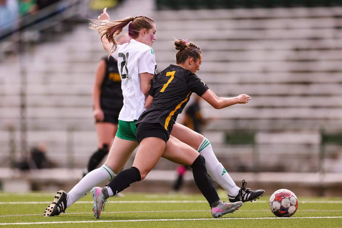 Southlake Carroll defender Berklee McCombs (21) attempts to take away the ball from a Forney player in a UIL Class 6A Division 2 girls soccer state semifinal on Saturday, April 4, 2026, at Memorial Stadium in Mesquite, Texas.