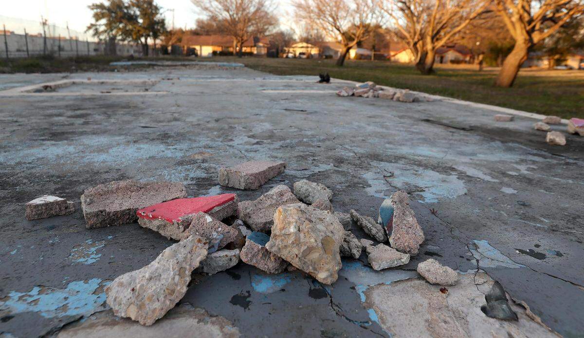 Iris Hernandez, left, and Jorge DelaTorre are working to transform a vacant lot they purchased in East Arlington into single-family homes. The property was originally a community space, complete with a pool and restrooms, that the couple had to clear after acquiring the land in 2014.