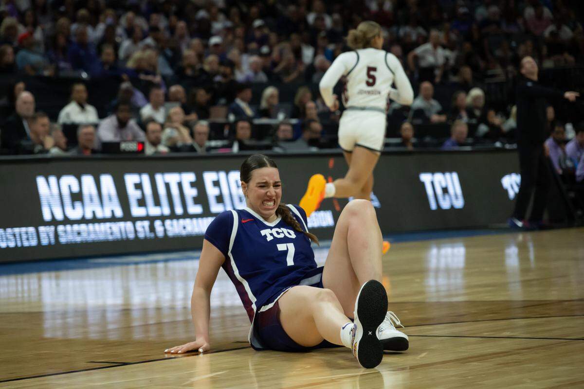 TCU forward Marta Suárez tries to shake off an injury in the first half against South Carolina in the Elite Eight of the NCAA Tournament on Monday at Golden 1 Center in Sacramento, Calif.