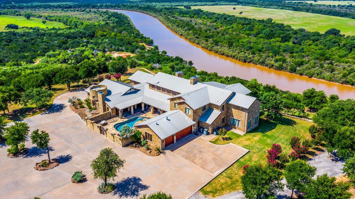 The property at 1300 Herron Bend Road sits on a hilltop near the apex of the Herron Bend of the Brazos.
