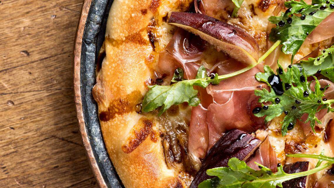 A prosciutto-fig pizza at Crú Food & Wine Bar.