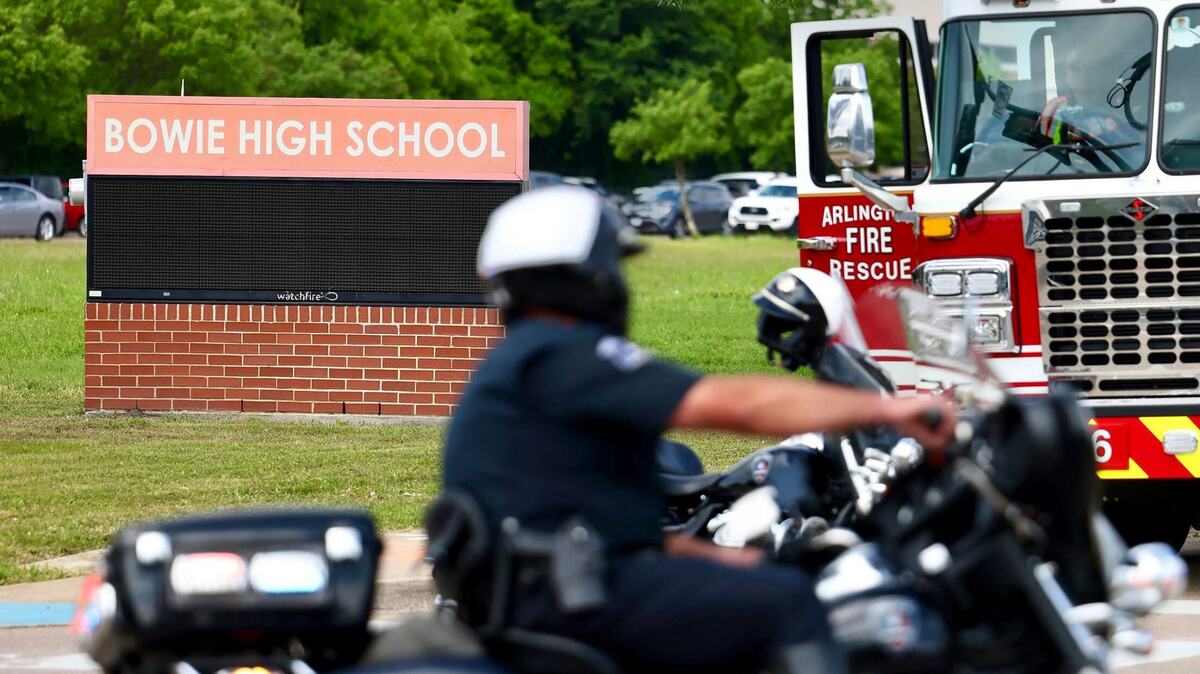 Emergency personnel investigate a shooting outside of Bowie High School in Arlington on Wednesday, April 24, 2024.