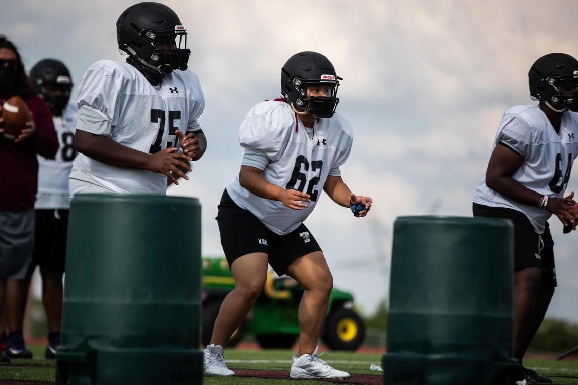 Timberview Junior Morgan Senior, center, lineman for junior varsity football, practices in full pads Monday, Sept. 14, 2020, in Arlington.