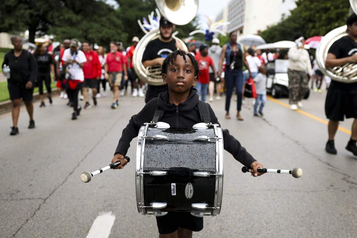 Elijah Rambo plays with Dunbar High School's marching band during the Opal Lee Walk for Freedom on Friday, June 19, 2026, in Fort Worth.
