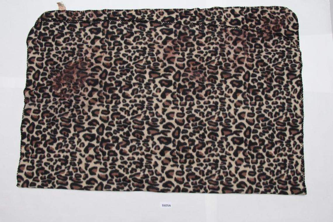 Arlington police on Tuesday released this image of a cheetah-print blanket a baby boy was found swaddled in inside of a suitcase on Saturday morning. The boy is recovering, police said, and the department is looking for the identity of the mother.